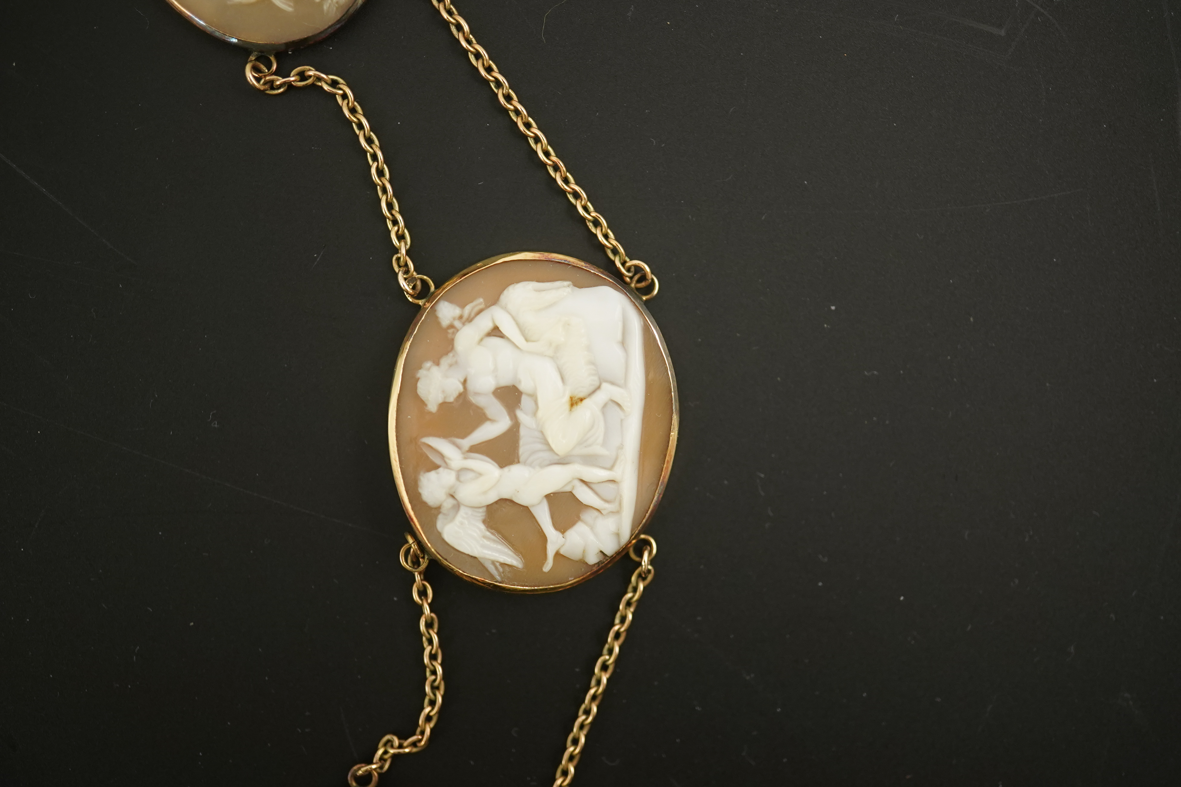 An early 19th century Italian Grand Tour gold double chain link and ten graduated oval cameo shell set necklace